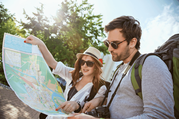 Traveler exploring Hanoi with city tour map – discover Vietnam’s heart